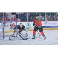 Conor Riley of the Adirondack Thunder sets up in front of the Newfoundland Growlers goal