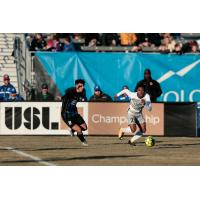 Sacramento Republic FC defender Shannon Gomez (right) sprints for the ball against the Colorado Springs Switchbacks