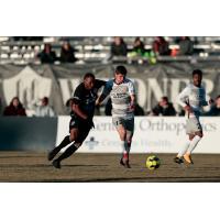 Sacramento Republic FC midfielder Drew Skundrich (right) with possession against the Colorado Springs Switchbacks