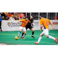 Mississauga MetroStars' Sebastian Lopez is challenged by the Baltimore Blast