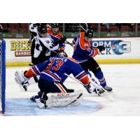 Utah Grizzlies pressure the Wichita Thunder goaltender