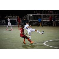 Forward Madison FC forward Mason Toye  shields a Chattanooga Red Wolves SC player