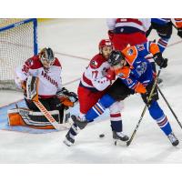 Allen Americans goaltender Lukas Hafner and forward Duggie Lagrone attempt to keep the Tulsa Oilers at bay