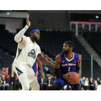 Halifax Hurricanes centre Rhamel Brown (left) vs. the Cape Breton Highlanders