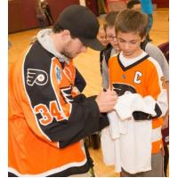 Alex Lyon of the Lehigh Valley Phantoms signing autographs for young fans