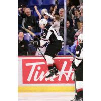 Owen Hardy of the Vancouver Giants jumps against the glass after a goal