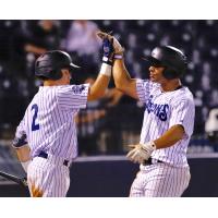 Tampa Tarpons SS Diego Castillo and 1B Dermis Garcia exchange high fives