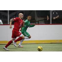 Adam James of the Kansas City Comets races past a Dallas Sidekicks defender during Kansas City's 8-3 win