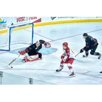 Corey Mackin of the Allen Americans (center) vs. the Rapid City Rush