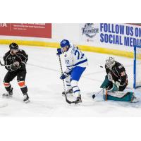 Wichita Thunder forward Beau Starrett in front of Kansas City Mavericks goaltender Andrew Shortridge