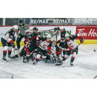 Prince George Cougars clear the puck after a scrum in front of their net vs. the Vancouver Giants