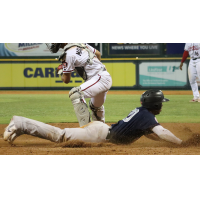 Oswald Peraza slides home for the Somerset Patriots