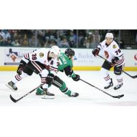 Rockford IceHogs' Luke Philp and Jakub Galvas battle Texas Stars' Oskari Laaksonen