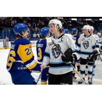 Saskatoon Blades' Spencer Shugrue congratulates Winnipeg ICE's Carson Lambos