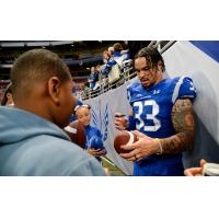 St. Louis Battlehawks linebacker Tré Watson signs autographs