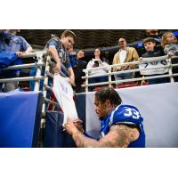 St. Louis Battlehawks linebacker Tré Watson signs for the fans