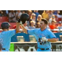 Victoria HarbourCats' Lane Brewster congratulates Michael Crossland