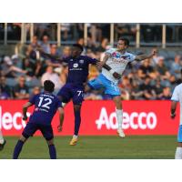 Louisville City' FCs Enoch Mushagalusa and Tyler Gibson versus Las Vegas Lights FC's Jacob Bushue