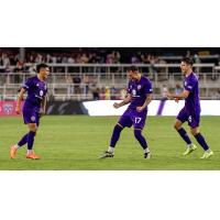 Louisville City FC's Ray Serrano, Cameron Lancaster and Wes Charpie celebrate win