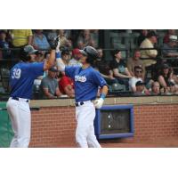 Evansville Otters' Aaron Beck congratulates Tim Holdgrafer