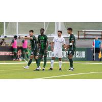 Lexington Sporting Club's Cesar Murillo Jr., Phila Dlamini and Phila Dlamini and Richmond Kickers' Zaca Moran on game day