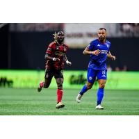 Atlanta United's Tristan Muyumba and Cruz Azul's Moisés Vieira on the field