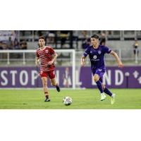 Louisville City FC defender Wesley Charpie (right)