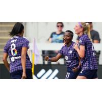 Racing Louisville FC forward Thembi Kgatlana (center) celebrates a goal