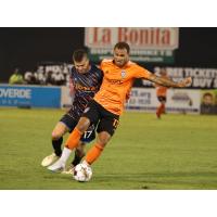 Las Vegas Lights FC's Jacob Bushue battles Orange County SC's Kevin Lankford