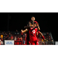 Phoenix Rising celebrates a goal