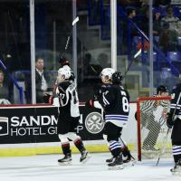 Vancouver Giants' Kyren Gronick and Wenatchee Wild's Jonas Woo on the ice