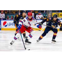 Kitchener Rangers' Carson Rehkopf and Barrie Colts' Cole Beaudoin and Olivier Savard in action