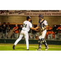 Wausau Woodchucks' Seth Clausen confers with teammate