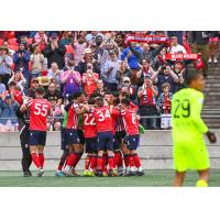 Atlético Ottawa celebrates during a 3-0 win against Forge FC