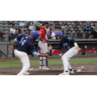 Lake Country DockHounds catcher Deivy Grullon (14) and infielder Blake Tiberi