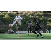 Louisville City FC's Ray Serrano and Oakland Roots' Napo Matsoso in action