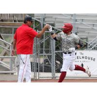 Sioux City Explorers' Cam Cannon congratulated by Field Manager Steve Montgomery