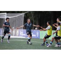 Tacoma Defiance's Chris Aquino, Faysal Bettache, and Blake Bowen celebrate win