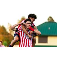 Atlético Ottawa striker Samuel Salter celebrates