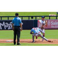 Tulsa Drillers shortstop Alex Freeland makes a throw to first