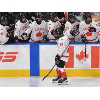 Vancouver Giants' Cameron Schmidt congratulated by team