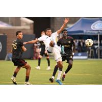 Chattanooga FC's Mehdi Ouamri and Atlanta United 2's Kaiden Moore and Noble Okello in action