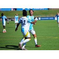 Chattanooga FC forward Jalen James congratulates defender Milo Garvanian