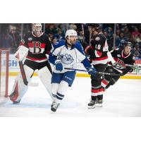 Syracuse Crunch's Joel Teasdale and Belleville Senators' Mads Sogaard and Filip Roos on the ice