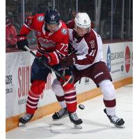 Peterborough Petes centre Brody Partridge (right) vs. the Oshawa Generals