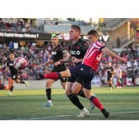 Atlético Ottawa and Vancouver FC in action