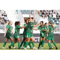 Lexington SC forward Madi Parsons (center) celebrates with teammates