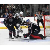 Wenatchee Wild's Evan Friesen and Tri-City Americans' Carter Savage and Lukas Matecha in action