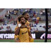 Rhode Island FC celebrate a playoff goal vs. Indy Eleven