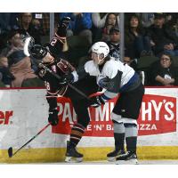 Wenatchee Wild's Deagan McMillan and Calgary Hitmen's Sawyer Mayes in action